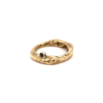 With a bezel set black diamond, the Odyssey Ring combines your love for nature and adds protection and postive energy.  Each ring is imbued with character and soulful imperfections making it everyone's favorite!